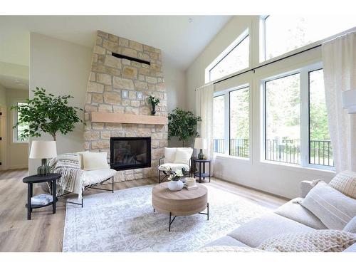 Meadow Ponds Drive, Rural Clearwater County, AB - Indoor Photo Showing Living Room With Fireplace