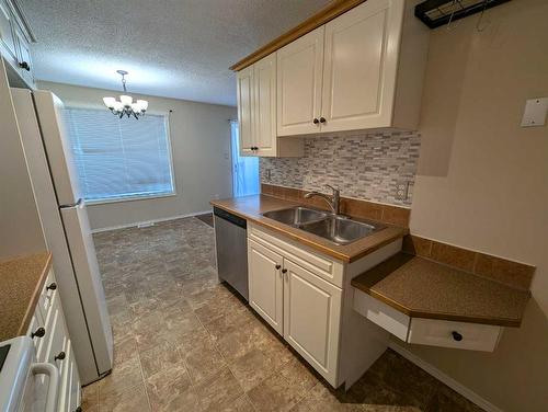 #2-19 Nyberg Avenue, Red Deer, AB - Indoor Photo Showing Kitchen With Double Sink