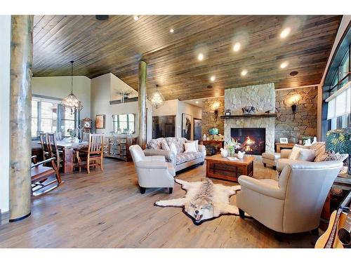 32244 Hwy 2A, Rural Mountain View County, AB - Indoor Photo Showing Living Room With Fireplace