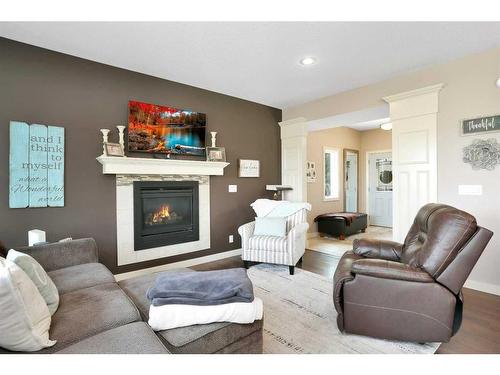 11 Henderson Close, Penhold, AB - Indoor Photo Showing Living Room With Fireplace