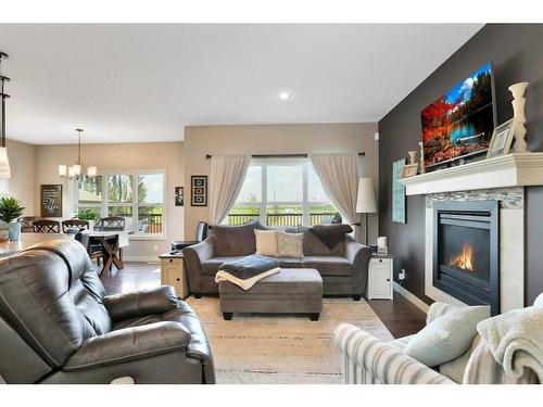 11 Henderson Close, Penhold, AB - Indoor Photo Showing Living Room With Fireplace