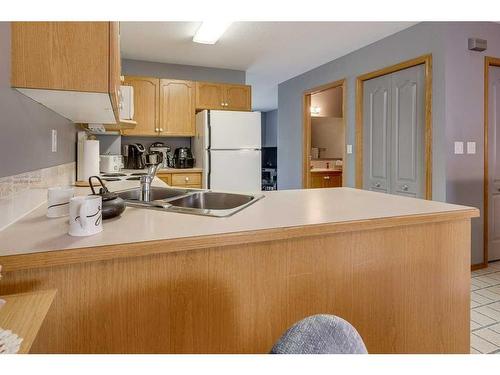 3502-3504-3508-3500 48 Avenue, Red Deer, AB - Indoor Photo Showing Kitchen With Double Sink