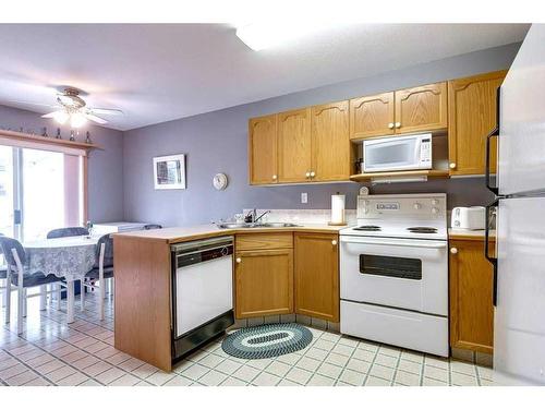 3502-3504-3508-3500 48 Avenue, Red Deer, AB - Indoor Photo Showing Kitchen With Double Sink