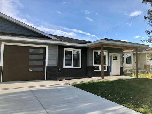 #1-4738 49A Avenue, Lacombe, AB - Outdoor With Facade