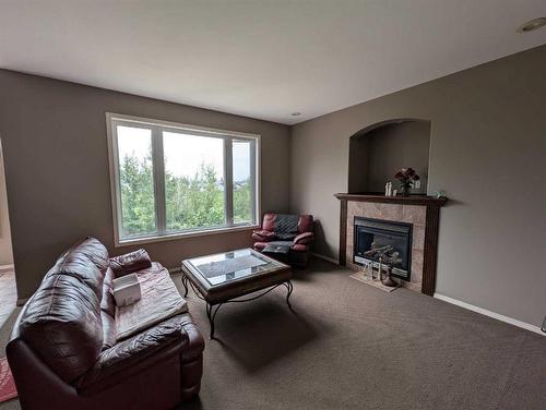 53 Pondside Crescent, Blackfalds, AB - Indoor Photo Showing Living Room With Fireplace