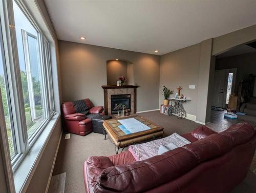 53 Pondside Crescent, Blackfalds, AB - Indoor Photo Showing Living Room With Fireplace