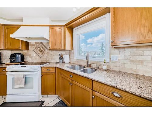 14 Langford Crescent, Red Deer, AB - Indoor Photo Showing Kitchen With Double Sink