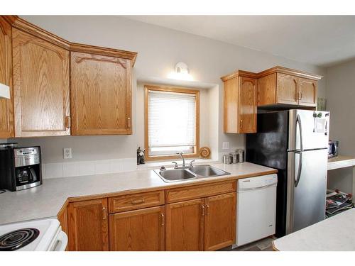 48 Chism Close, Red Deer, AB - Indoor Photo Showing Kitchen With Double Sink