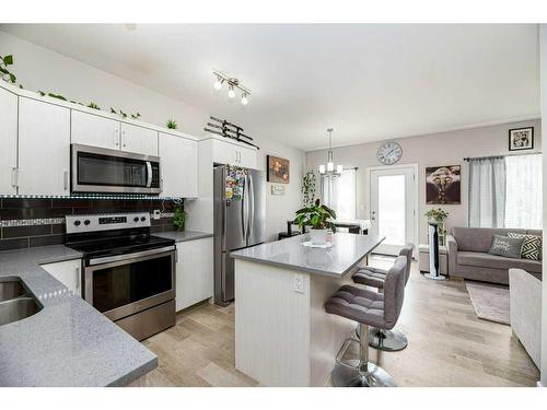 107-148 Vanier Drive, Red Deer, AB - Indoor Photo Showing Kitchen With Double Sink