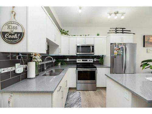 107-148 Vanier Drive, Red Deer, AB - Indoor Photo Showing Kitchen With Double Sink