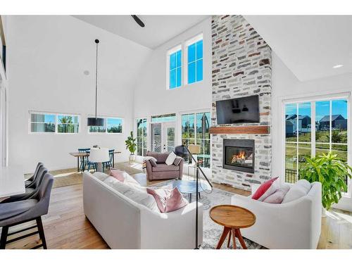 12 Songbird Green, Sylvan Lake, AB - Indoor Photo Showing Living Room With Fireplace