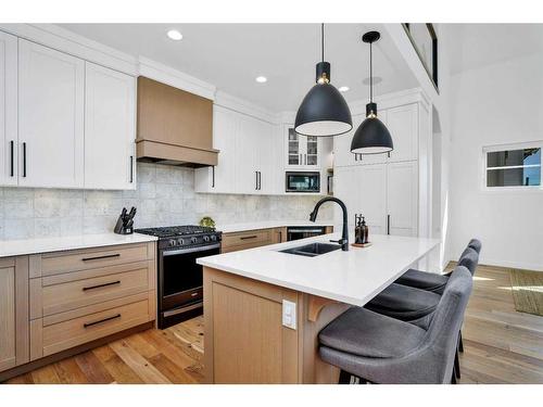 12 Songbird Green, Sylvan Lake, AB - Indoor Photo Showing Kitchen With Double Sink With Upgraded Kitchen