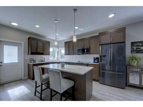 55 Henderson Crescent, Penhold, AB - Indoor Photo Showing Kitchen With Stainless Steel Kitchen With Upgraded Kitchen