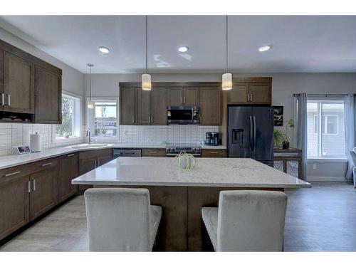 55 Henderson Crescent, Penhold, AB - Indoor Photo Showing Kitchen With Stainless Steel Kitchen With Upgraded Kitchen