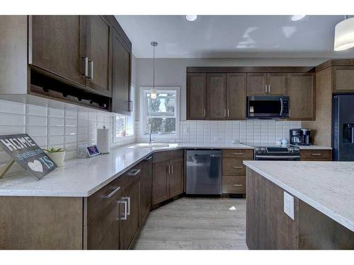 55 Henderson Crescent, Penhold, AB - Indoor Photo Showing Kitchen With Double Sink