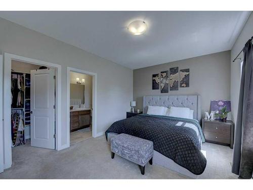 55 Henderson Crescent, Penhold, AB - Indoor Photo Showing Bedroom