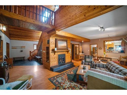 127-44101 Range Road 214, Rural Camrose County, AB - Indoor Photo Showing Living Room With Fireplace