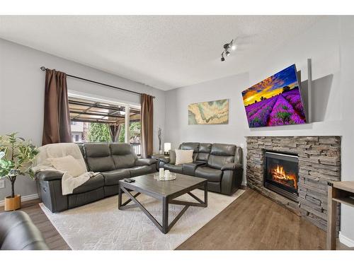 60 Jarvis Avenue, Red Deer, AB - Indoor Photo Showing Living Room With Fireplace