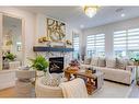 191 Cranston Gate Se, Calgary, AB  - Indoor Photo Showing Living Room With Fireplace 