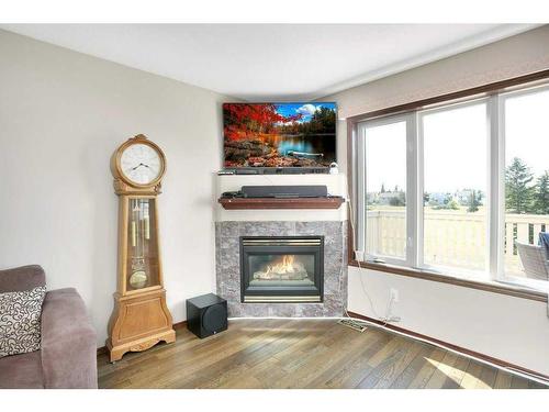 64 Daines Avenue, Red Deer, AB - Indoor Photo Showing Living Room With Fireplace