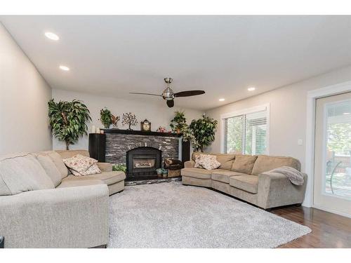 139 Armitage Close, Red Deer, AB - Indoor Photo Showing Living Room With Fireplace