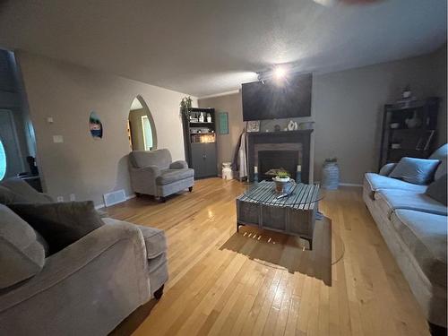 6117 32 Avenue, Camrose, AB - Indoor Photo Showing Living Room With Fireplace