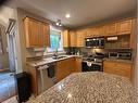 6117 32 Avenue, Camrose, AB  - Indoor Photo Showing Kitchen With Double Sink 