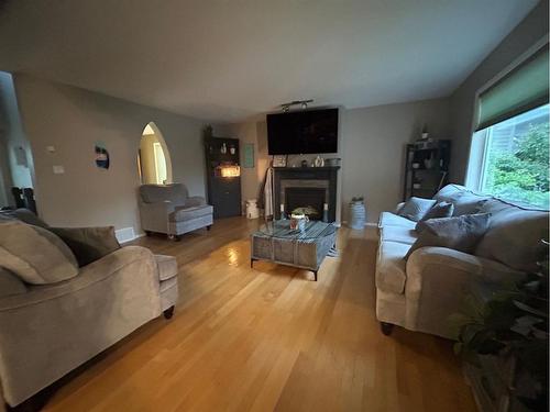 6117 32 Avenue, Camrose, AB - Indoor Photo Showing Living Room With Fireplace