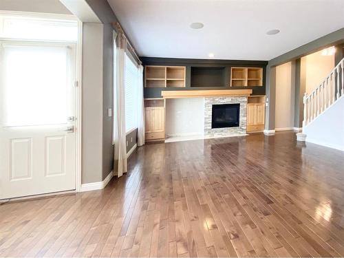 59 Panatella Boulevard Nw, Calgary, AB - Indoor Photo Showing Living Room With Fireplace