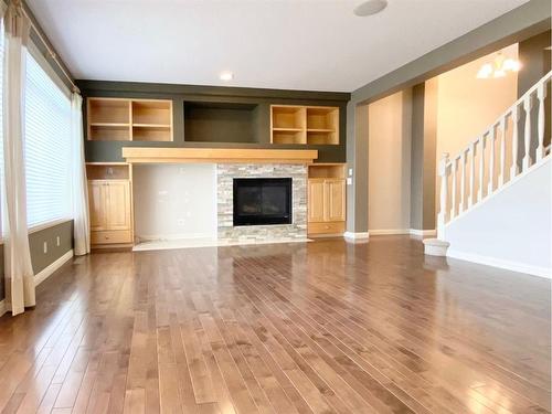 59 Panatella Boulevard Nw, Calgary, AB - Indoor Photo Showing Living Room With Fireplace