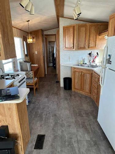 3017 35468 Range Road 30, Rural Red Deer County, AB - Indoor Photo Showing Kitchen With Double Sink