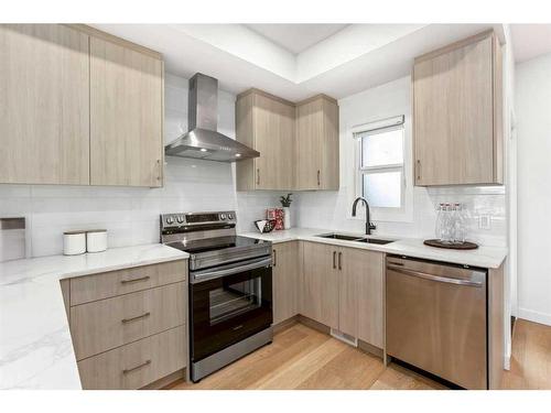 14-903 Mahogany Boulevard Se, Calgary, AB - Indoor Photo Showing Kitchen With Double Sink