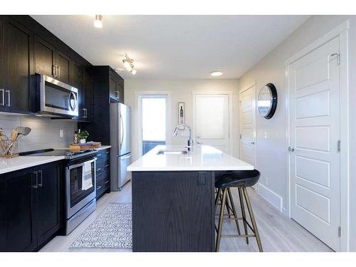 199 Vantage Drive Drive, Cochrane, AB - Indoor Photo Showing Kitchen With Upgraded Kitchen