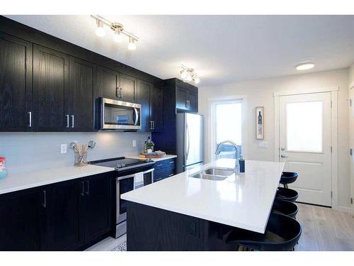 199 Vantage Drive Drive, Cochrane, AB - Indoor Photo Showing Kitchen With Double Sink With Upgraded Kitchen