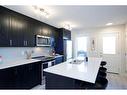 199 Vantage Drive Drive, Cochrane, AB  - Indoor Photo Showing Kitchen With Double Sink With Upgraded Kitchen 