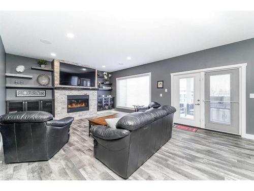 75 Valli Close, Sylvan Lake, AB - Indoor Photo Showing Living Room With Fireplace