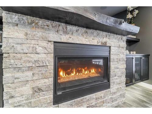 75 Valli Close, Sylvan Lake, AB - Indoor Photo Showing Living Room With Fireplace