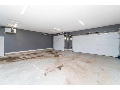 75 Valli Close, Sylvan Lake, AB - Indoor Photo Showing Garage