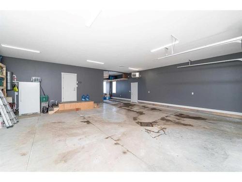 75 Valli Close, Sylvan Lake, AB - Indoor Photo Showing Garage