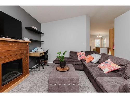 143 Deschner Close, Red Deer, AB - Indoor Photo Showing Living Room With Fireplace