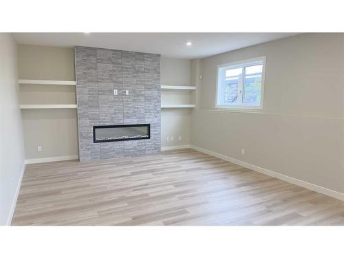 60 Thorkman Avenue, Red Deer, AB - Indoor With Fireplace