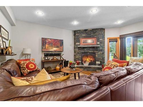 117 & 121-25054 South Pine Lake Road, Rural Red Deer County, AB - Indoor Photo Showing Living Room With Fireplace