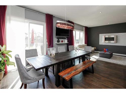 121 Traptow Close, Red Deer, AB - Indoor Photo Showing Dining Room With Fireplace