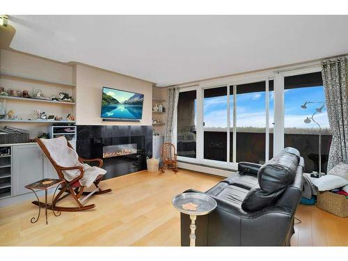 1011-4902 37 Street, Red Deer, AB - Indoor Photo Showing Living Room With Fireplace