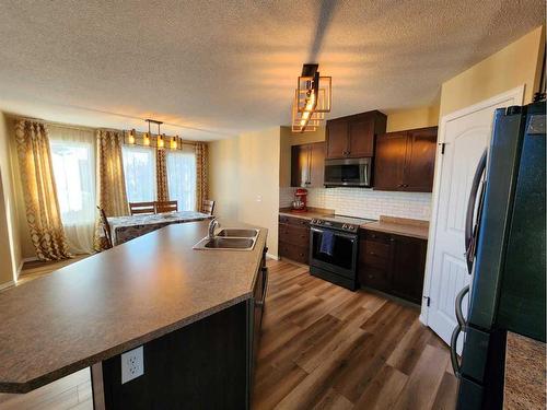 41 Juniper Close, Red Deer, AB - Indoor Photo Showing Kitchen With Double Sink