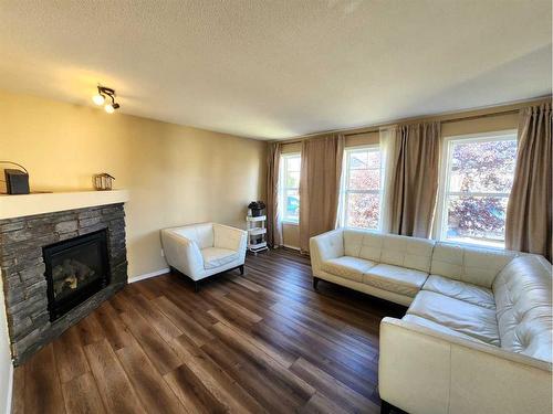 41 Juniper Close, Red Deer, AB - Indoor Photo Showing Living Room With Fireplace