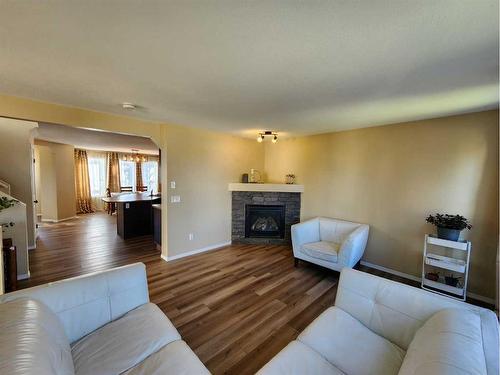 41 Juniper Close, Red Deer, AB - Indoor Photo Showing Living Room With Fireplace