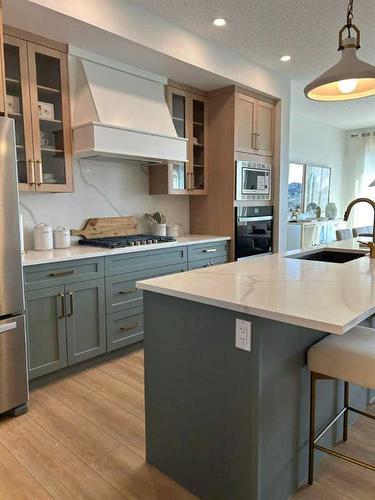 174 Saddlebred Place Se, Cochrane, AB - Indoor Photo Showing Kitchen With Stainless Steel Kitchen