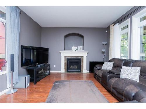 32 Wiley Crescent, Red Deer, AB - Indoor Photo Showing Living Room With Fireplace