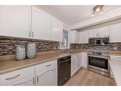 222 Cedarwood Park Sw, Calgary, AB - Indoor Photo Showing Kitchen With Double Sink